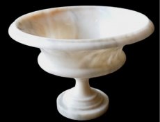 large marble bowl on foot.