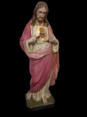 roze Jezus beeld in plaaster.
